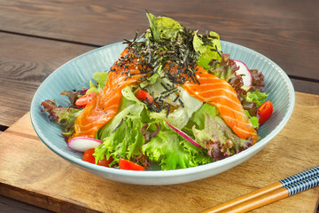 Salmon Salad Japanese style on wood table.Healthy Concept.Close up.