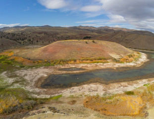 Audacious aerial Photography of the vibrant and  photogenic John Day Fossil Beds and the iridescent Painted Hills Reservoir of Wheeler County in Mitchell, Oregon