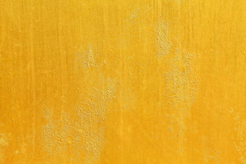 Golden yellow textured wall for background and luxurious graphic design purpose
