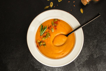 pumpkin or carrot cream soup (first course, healthy food, diet) menu concept. food background. copy space. Top view