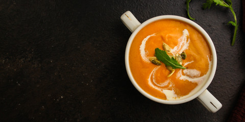 pumpkin or carrot cream soup (first course, healthy food, diet) menu concept. food background. copy space. Top view
