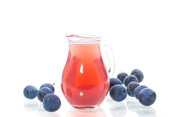 sweet compote of autumn blue plums isolated on white background