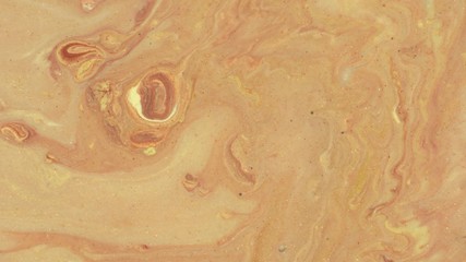 Beige, ochre, brown, gold colors liquid paint mix