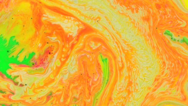 Abstract Rainbow Swirl. Flows of paint mix blur on all sides in slow motion. Indian pattern vivid colors of yellow red acid orange green pink