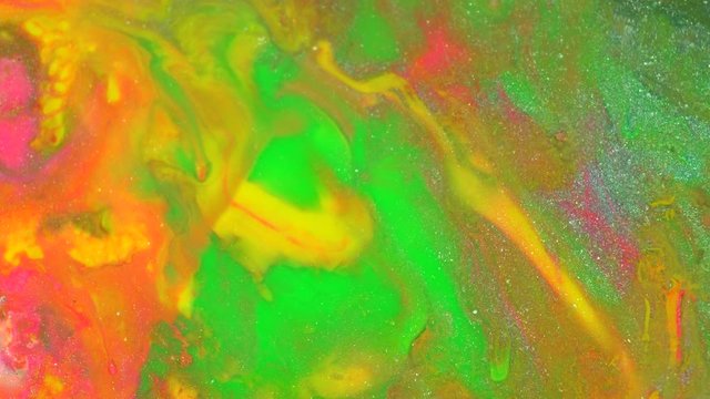 Rainbow hippie vivid colors of yellow red orange UFO green. Abstract liquid moving colorful background. Psychedelic real pattern