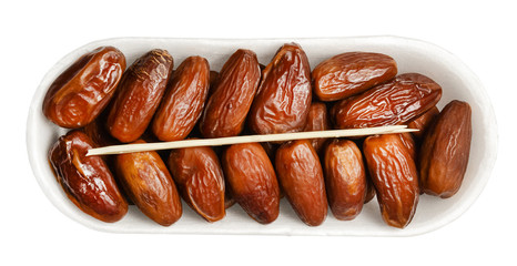Plastic packaging with dates isolated on a white background. Top view. Bright saturated colors and good texture. Clipping path.