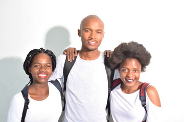 group of school students standing chatting on their phones