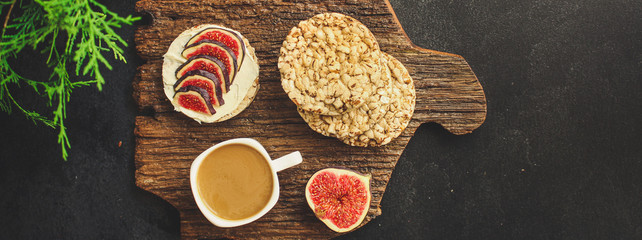 healthy food, sandwich, crisp bread, figs, coffee (breakfast or snack, cream cheese, butter, yogurt) menu concept. food background. copy space. Top view