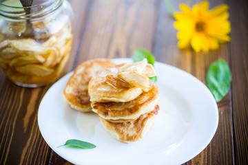 sweet fried fritters with apple jam in a plate