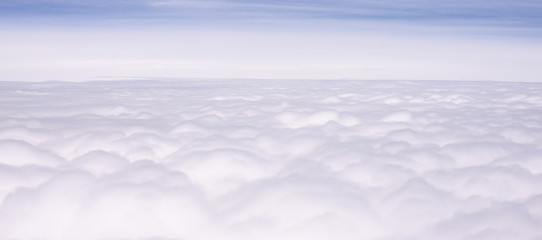 The background image of white clouds in the atmosphere