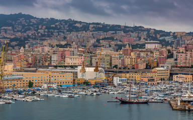 Genoa Panoramic View. Exposure of Genoa (Genova) from an high angle view at sunrise featuring the port and city.