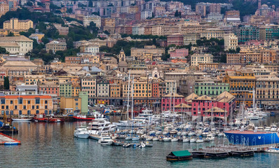Fototapeta na wymiar Genoa Panoramic View. Exposure of Genoa (Genova) from an high angle view at sunrise featuring the port and city.