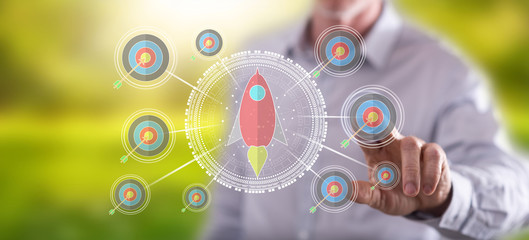 Fototapeta premium Man touching a business target concept