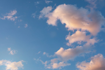 sky yellow and blue colors. sunset sky background with white clouds.