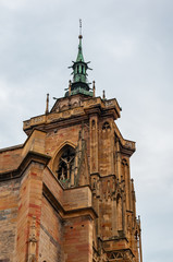 Fototapeta na wymiar Colmar in Alsace, France. Detail of the Collegiate Church of San Martino, one of the symbols of the city on the canals, also famous for the production of Riesling, Gewurztraminer, Muscat, Pinot wines.