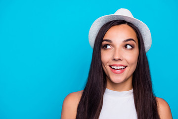 Fototapeta premium Closeup photo of pretty lady looking wondered to empty space wear nice white hat and tank-top isolated blue color background