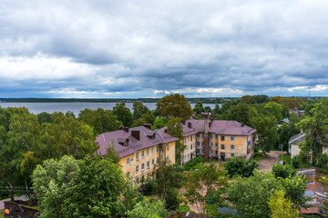 Fototapeta na wymiar Panoramic view of historical city center and lake Seliger in Ostashkov, Tver region, Russia. Picturesque aerial view of Lake Seliger in Ostashkov.