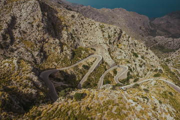 Fototapeta premium Aerial drone photo of Sa Calobra serpentine road to sea. Mallorca, Balearic Islands, Spain.