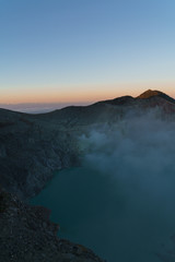 First light with fog. Sunrise on on the mountain  Ijen  Java ,Indonesia.