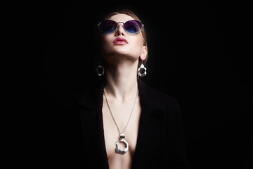 Beautiful sexy woman in jewelry and sunglasses