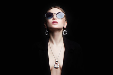 Beautiful sexy woman in jewelry and sunglasses