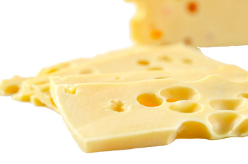 Pieces of cheese on white background