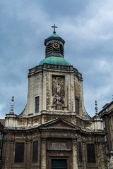 Fototapeta na wymiar Main building of Church Of Notre Dame Du Finistere at the busy shopping street Rue Neuve.