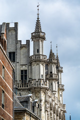 Fototapeta na wymiar Gothic architecture with rooftops details at the City hall of Brussels, Grand square in downtown of Brussels, Belgium.