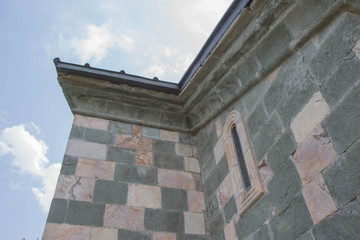 texture of masonry, the fragment of a stone wall of an ancient temple. ancient stone temple in...