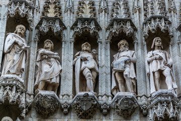 Group of statues from medieval facade on Grand Place in Brussels Belgium.