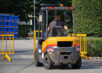 Forklift at work on the city street