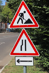 Road works and other traffic signs next to the road