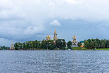 Obraz premium Picturesque view of Nilo Stolobensky Monastery on Lake Seliger, Tver region, Russia. Panoramic view of Nilo Stolobensky Monastery, Tver region, Russia.