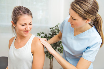 A Modern rehabilitation physiotherapist at work with client