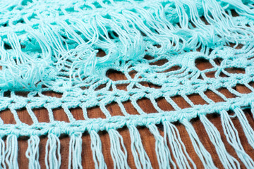 Handmade macrame yarn on wooden table, hobby and creativity concept