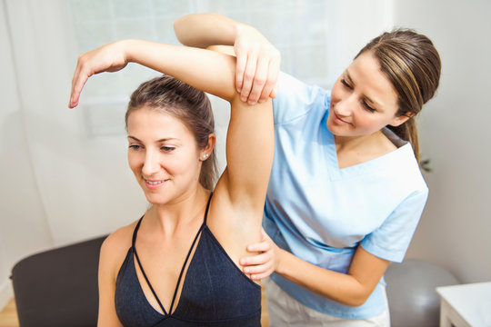 A Modern rehabilitation physiotherapist at work with client