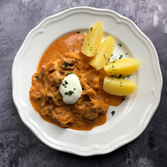 Hungarian goulash with parsley potatoes.