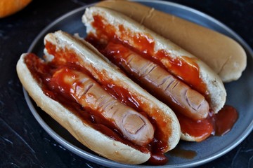 Hot Dog for Halloween. a hot dog sausage in a severed finger in abundance ketchup as blood. Food...