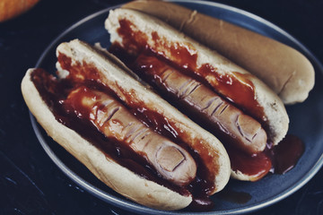 Hot Dog for Halloween. a hot dog sausage in a severed finger in abundance ketchup as blood. Food...