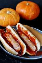 Hot Dog for Halloween. a hot dog sausage in a severed finger in abundance ketchup as blood. Food Ghoul. 