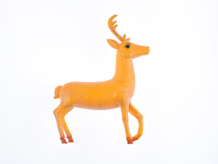 Fototapeta na wymiar decorative christmas golden deer on a white background