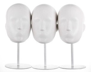 Isolated  set of faceless mannequin heads.