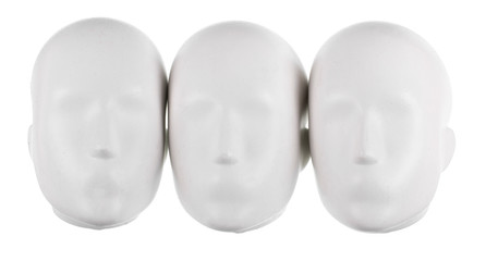 Isolated  set of faceless mannequin heads.