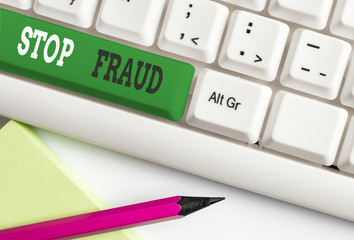 Conceptual hand writing showing Stop Fraud. Concept meaning campaign advices showing to watch out thier money transactions White pc keyboard with note paper above the white background