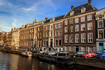 Fototapeta na wymiar amsterdam canals and houses in netherlands