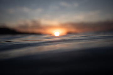 RED SUNSET AND REFLECTIONS ON THE SEA