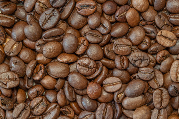 Cooked coffee beans bunch above view macro