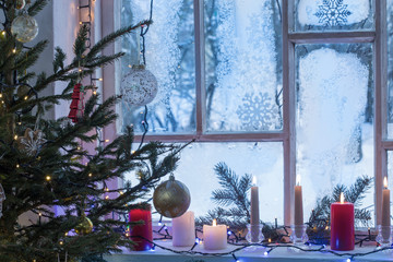 Christmas decorations on old wooden window