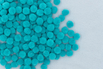A blue  Pom Pom background with white space