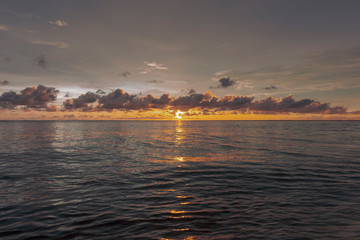 Sunset sky over tropical sea. Vintage filter